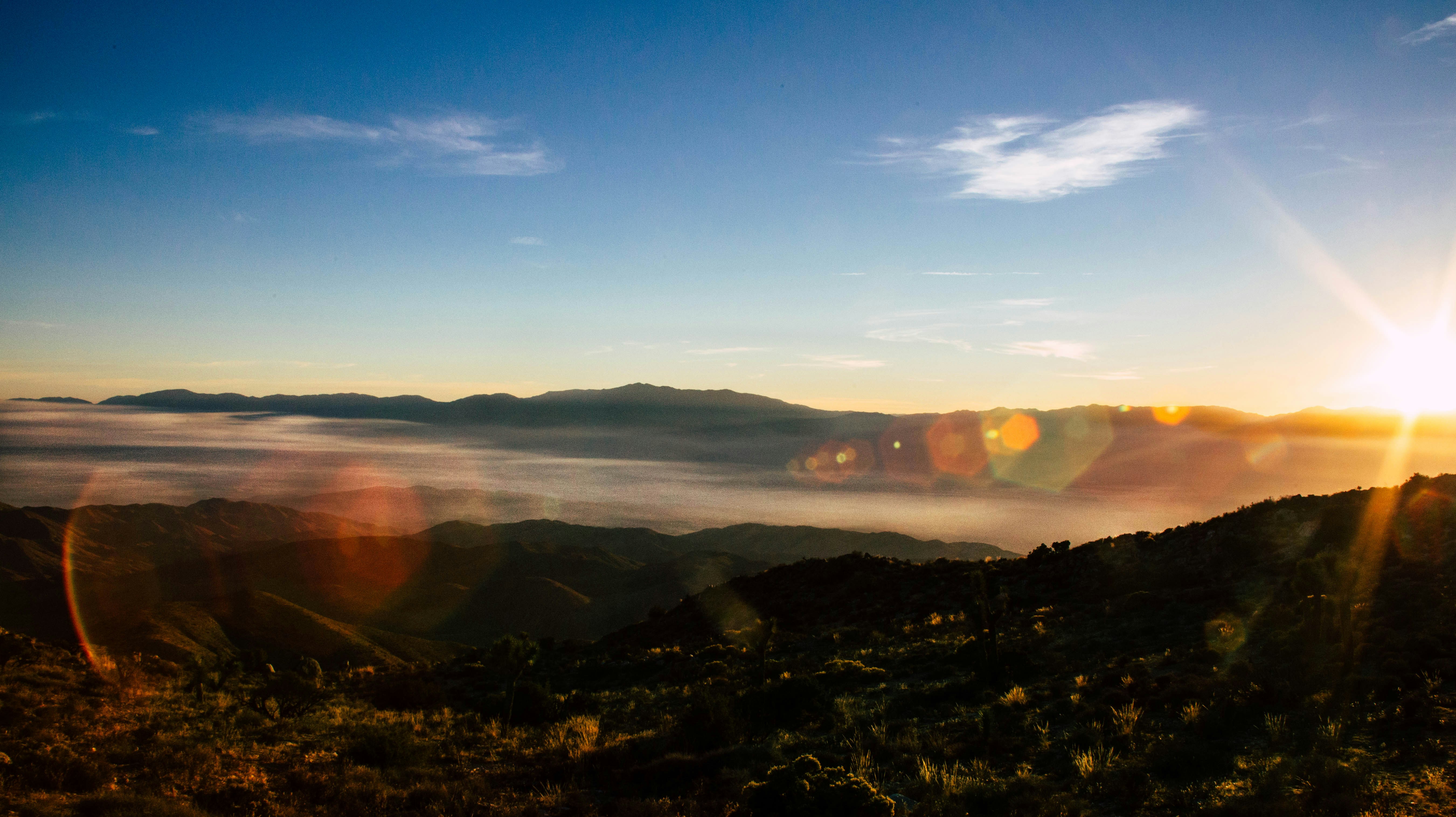 hazy smoke in valley with sun behind